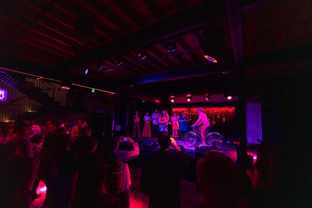 Winner being presented with bike raffle on stage