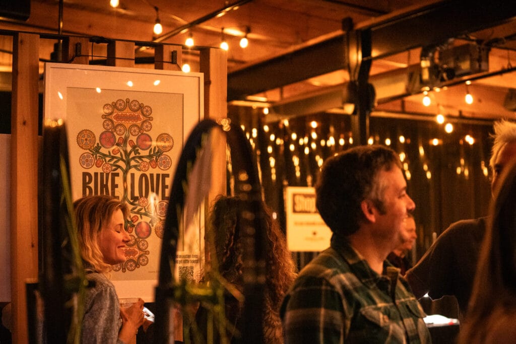 Bike Love poster hanging at event