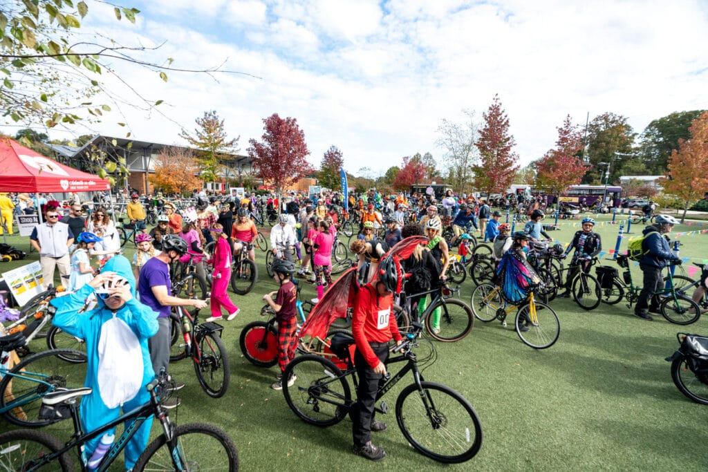 Bike riders at Pumpkin Pedaller Community Ride 2025 in Asheville