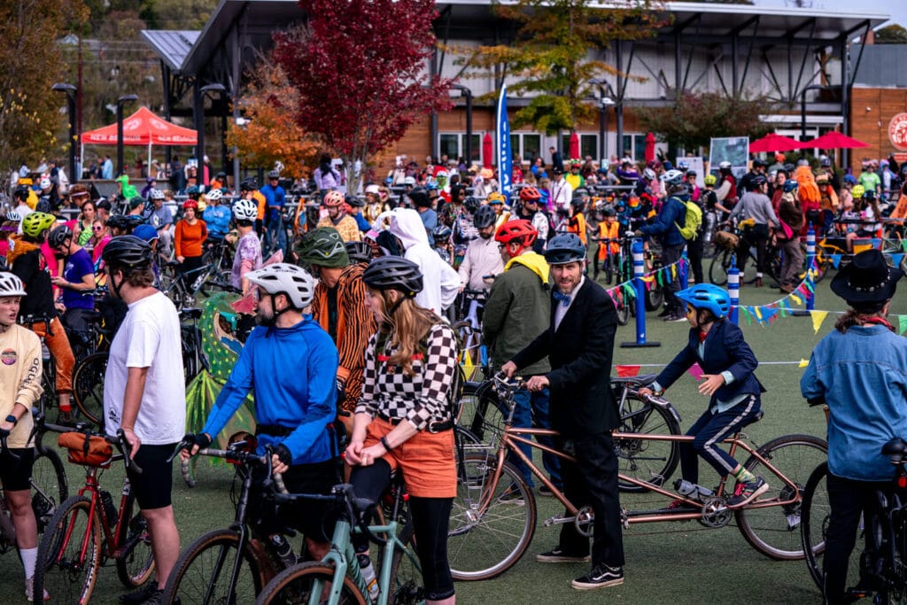 Bike riders at Pumpkin Pedaller Community Ride 2025 in Asheville